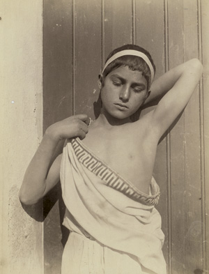 Lot 4054, Auction  117, Gloeden, Wilhelm von, Young boy in toga with headband